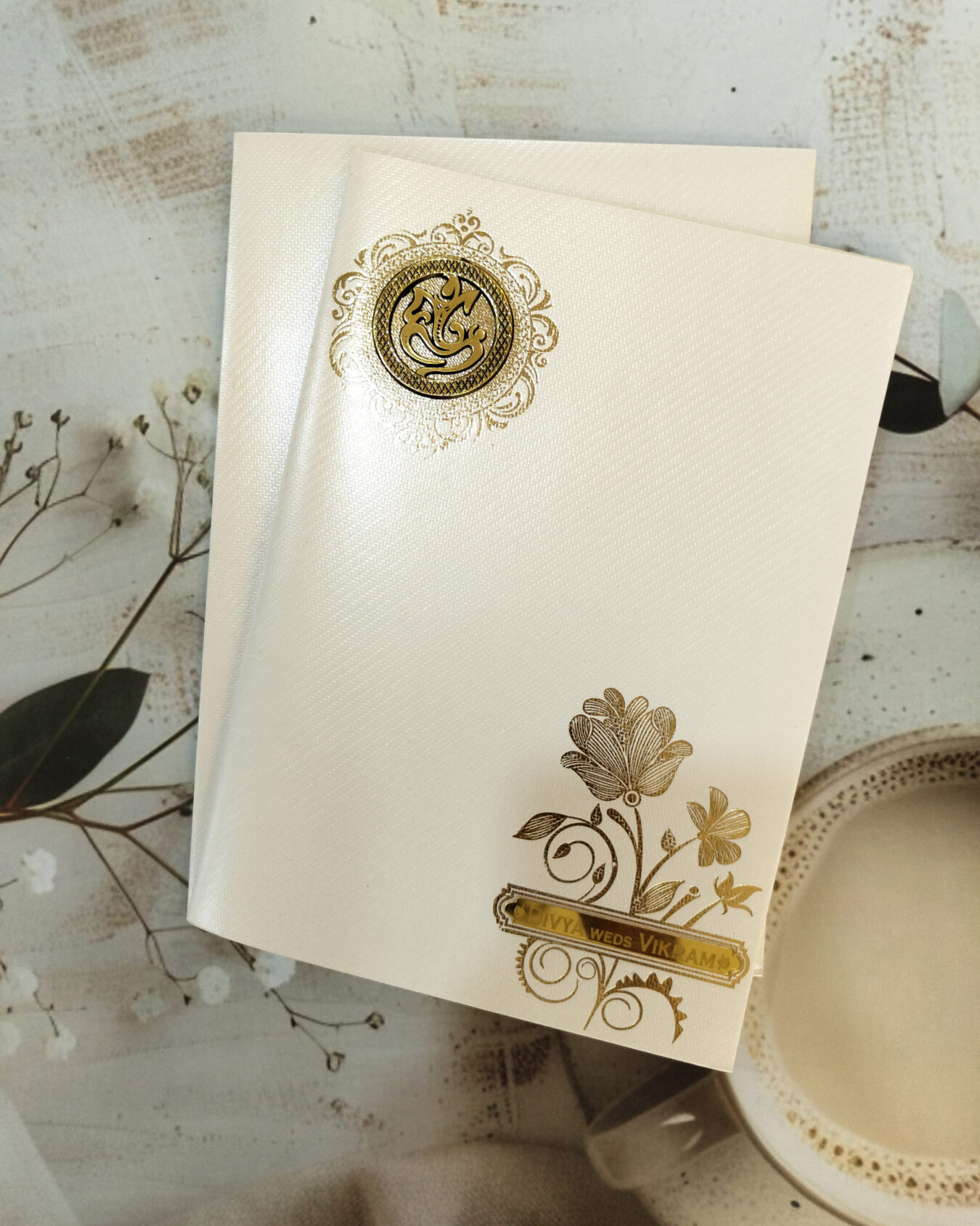 Premium Cream & Gold Ganesha Wedding Invitation Card with Custom Acrylic Nameplate and Matching Envelope