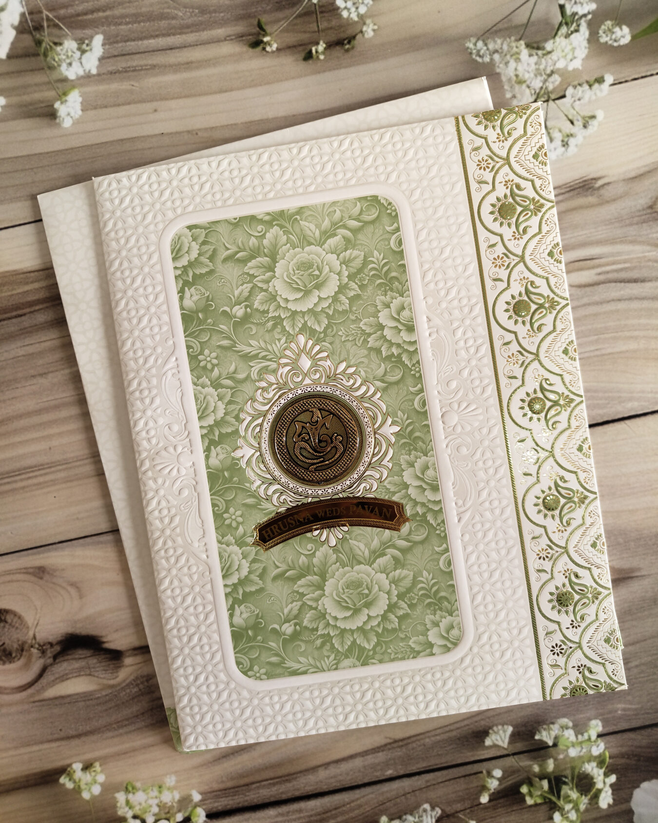 Green & White Embossed Floral Gold Foiled Wedding Invitation Card with Acrylic Nameplate, Customisable Emblem & Matching Envelope