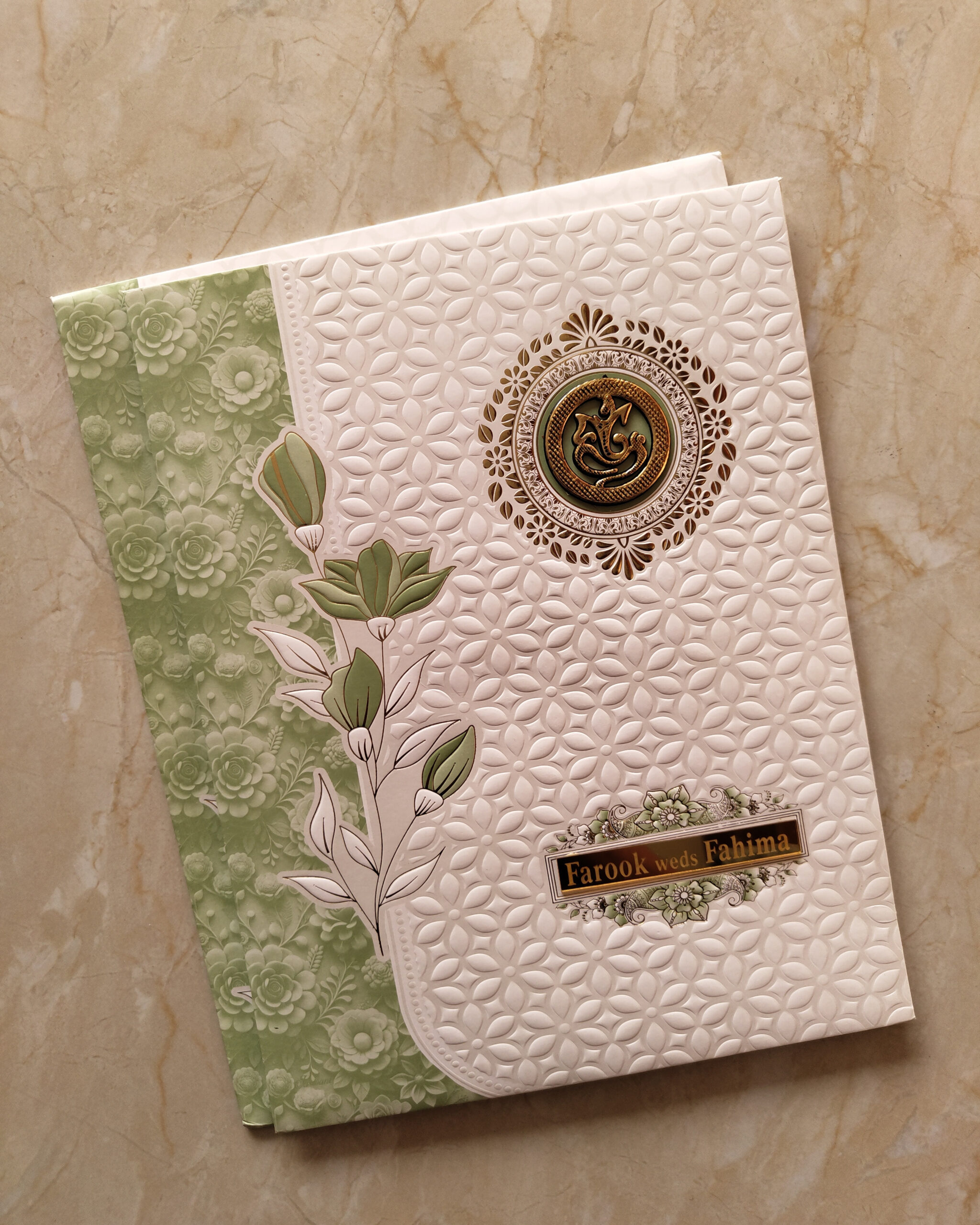 Elegant Olive Green Floral Embossed Wedding Invitation Card with Acrylic Nameplate, Customisable Emblem & Matching Envelope