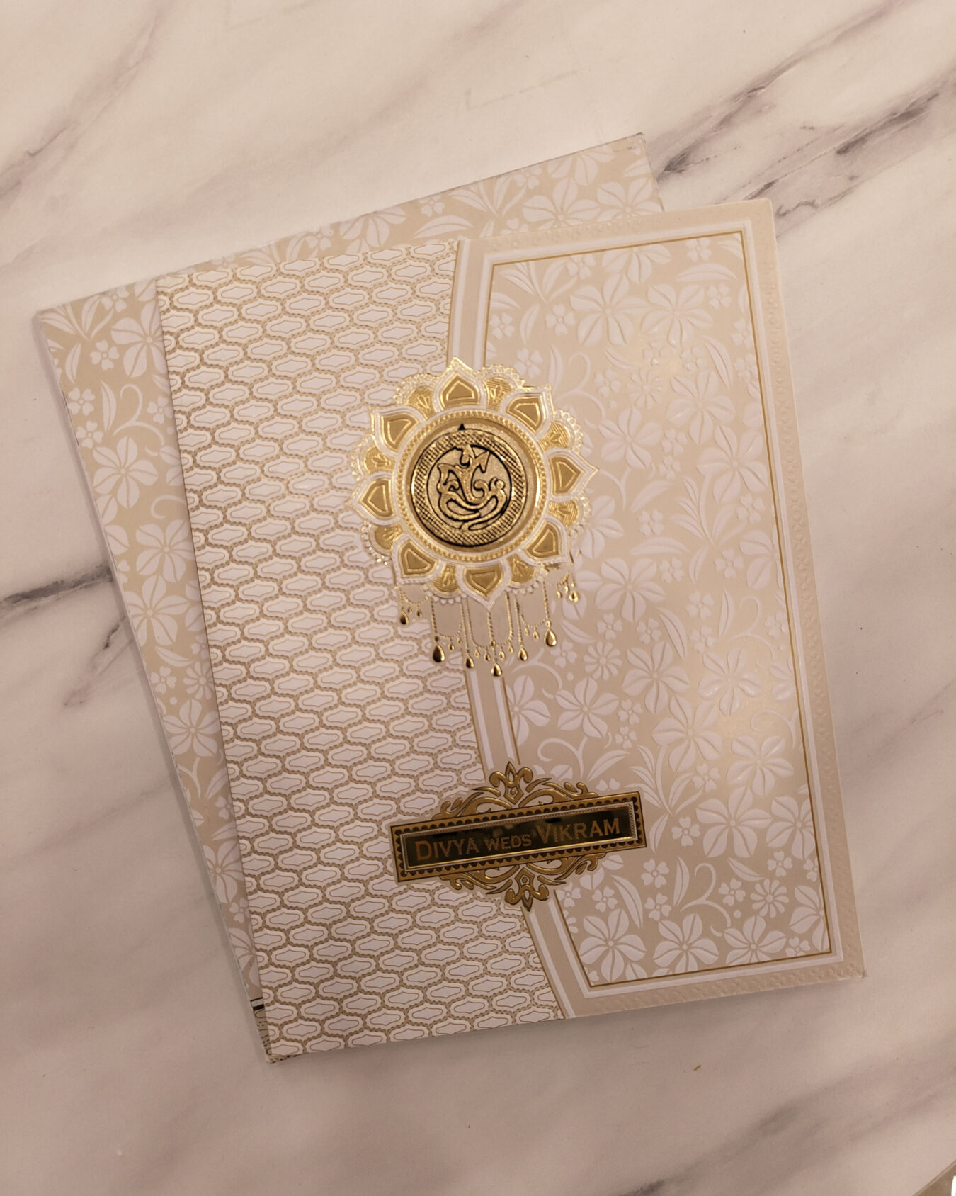 Cream & Gold Floral Embossed Wedding Invitation Card with Acrylic Nameplate & Customisable Emblem | Matching Envelope