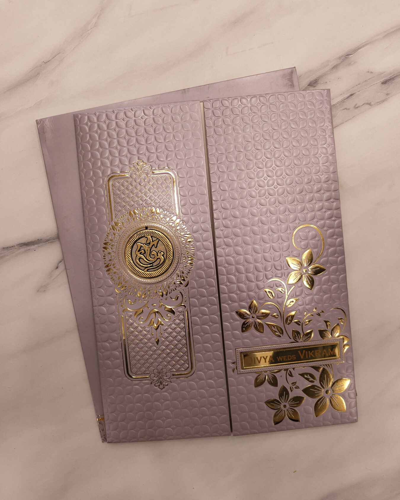 Metallic Lavender Embossed Wedding Invitation Card with Acrylic Nameplate & Customisable Emblem | Matching Envelope