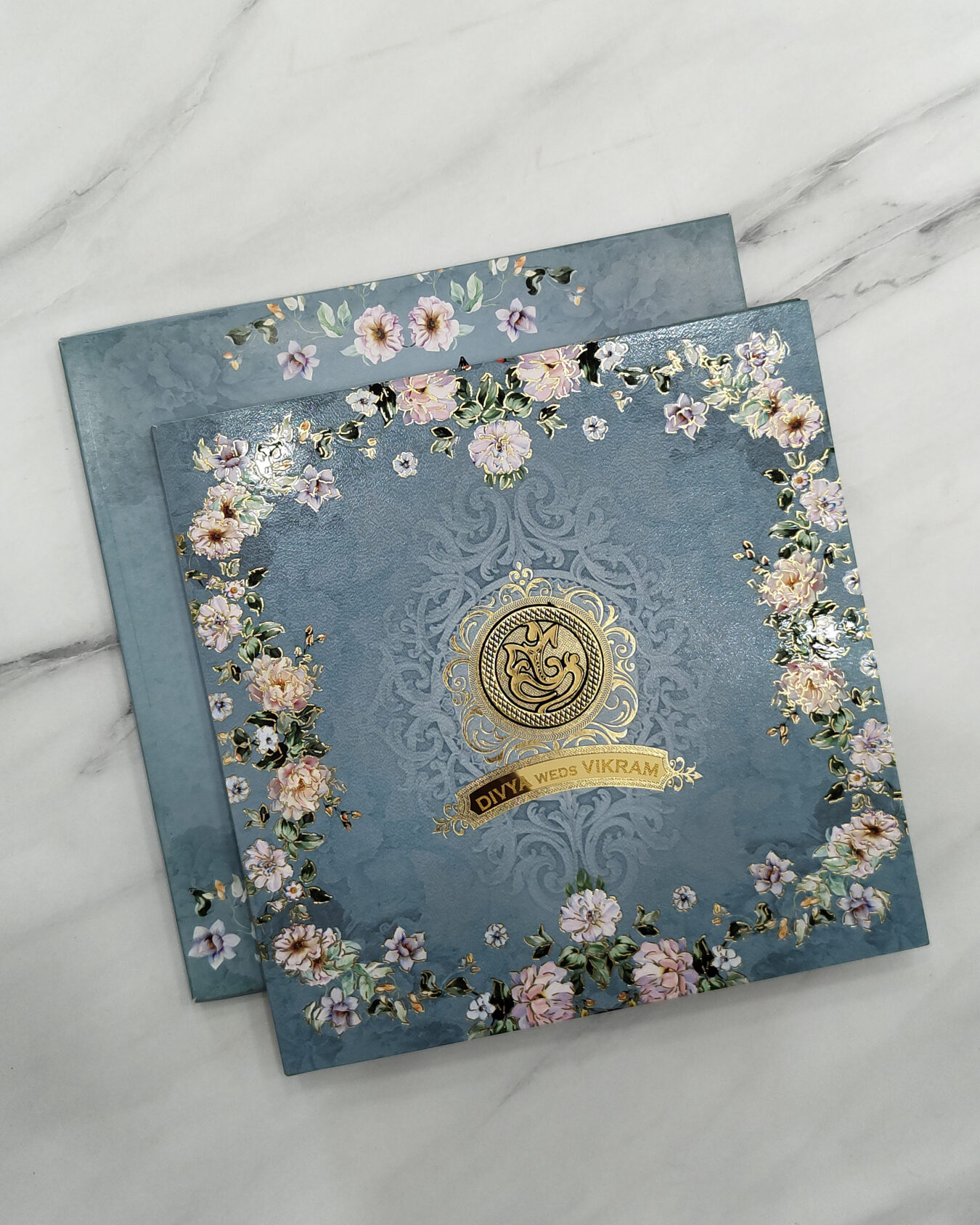 Aqua Blue Floral Border Square Wedding Invitation Card with Acrylic Nameplate & Customisable Emblem | Matching Envelope