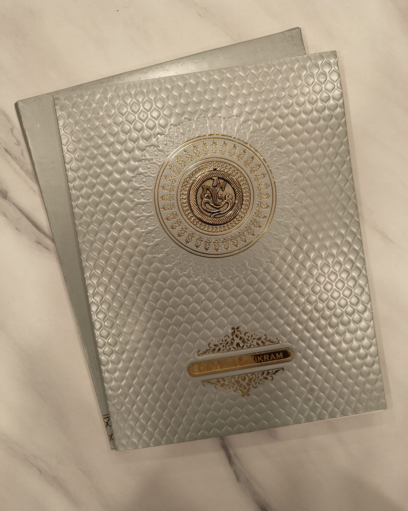 Metallic Grey Embossed Wedding Invitation Card with Acrylic Nameplate, Customisable Emblem & Matching Envelope